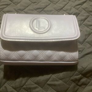 Brand is Loulou  it retails for 15-20$